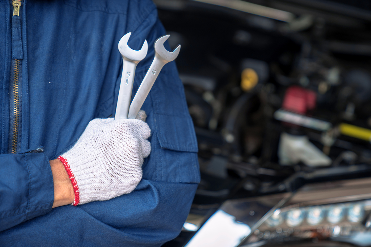 Auto mechanic working in the garage, Service and maintenance and car maintenance.